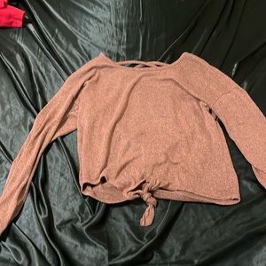 Cute sweater backing is crisscrossed.